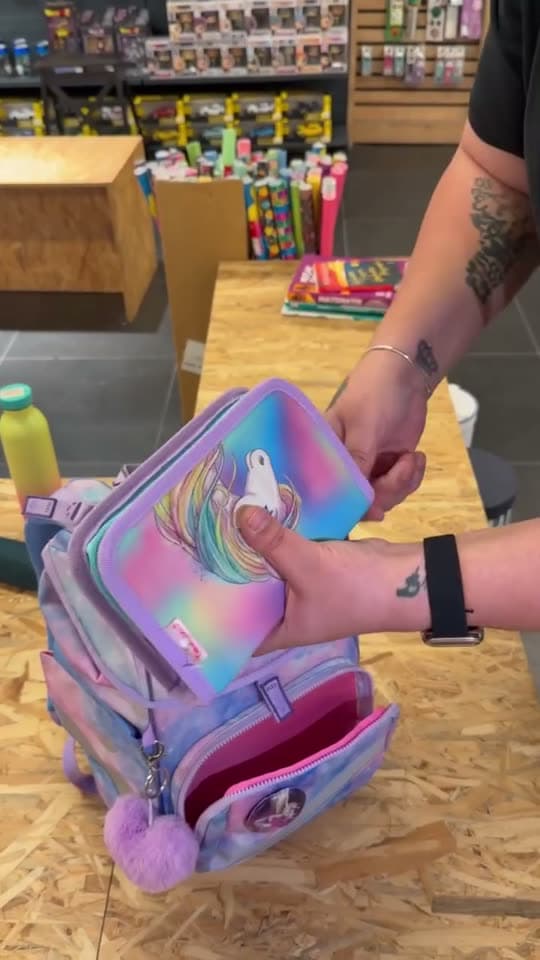 Backpack and pencil-case product demonstration filmed in an Atlas store