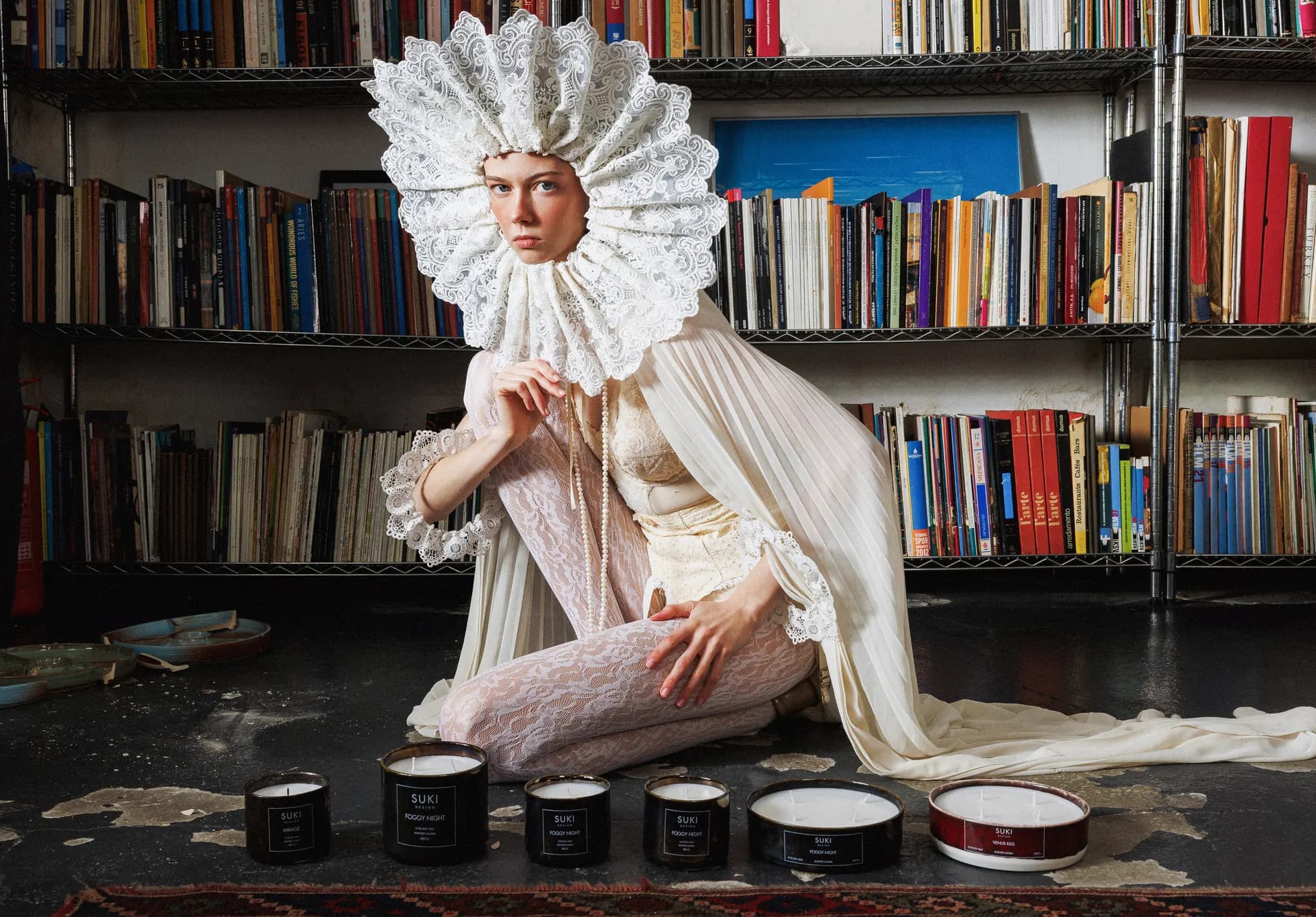 Suki Design editorial brand image presenting candles in a library setting